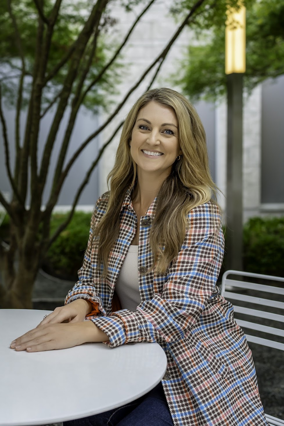 Holly Marie Thomson seated at an outdoor table in Columbus, Ohio