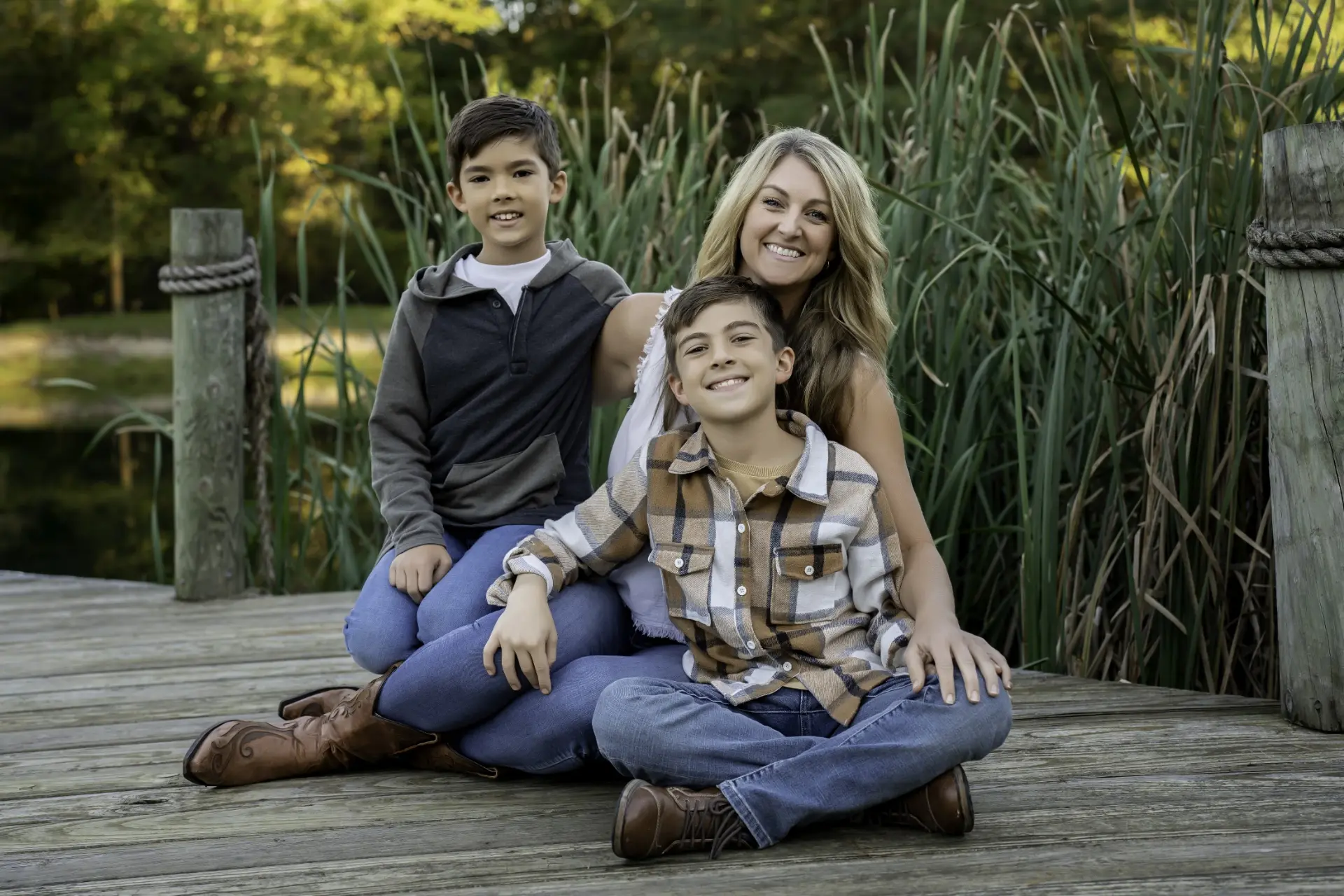 Holly Marie Thomson with her two sons on a dock by a pond in Central Ohio