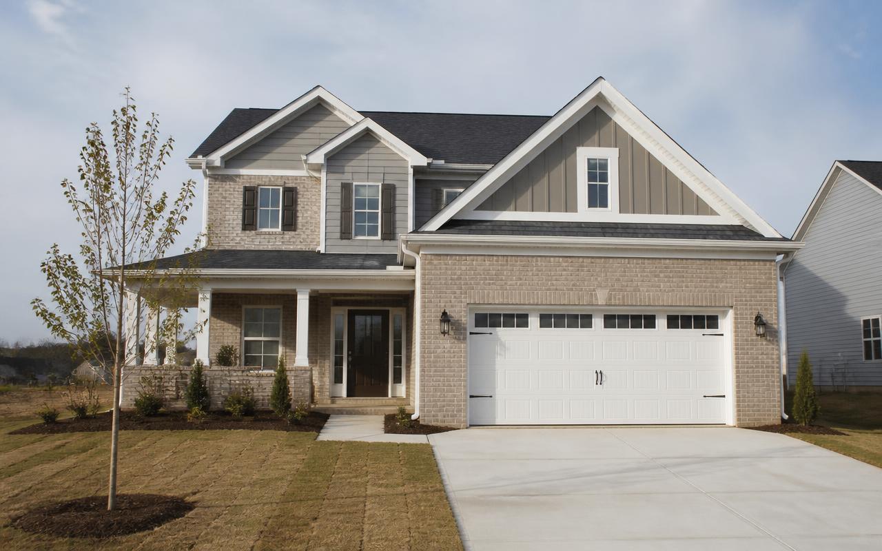 A newly built home with fresh landscaping on a Central Ohio street